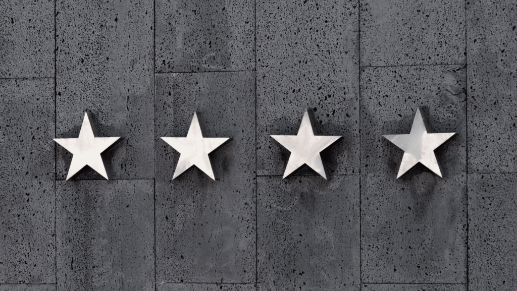 Four stars on a wall for hotel reviews post