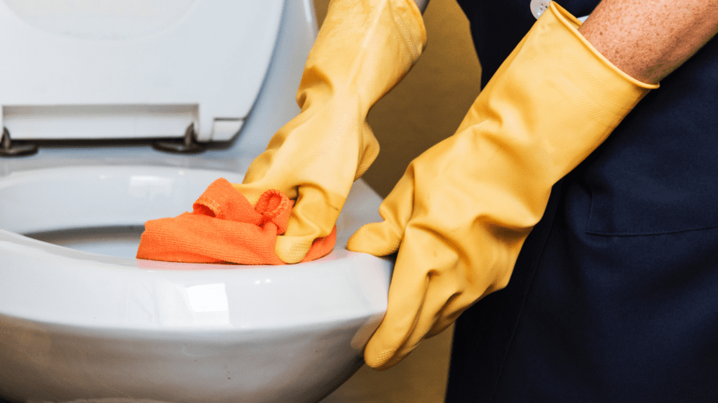 Yellow gloves eco-cleaning a toilet