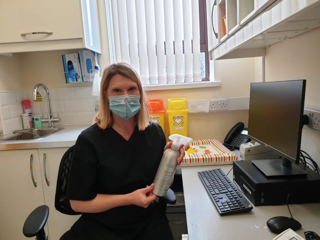 Dr Rowlands using General Purpose Sanitiser Concentrate in her GP surgery
